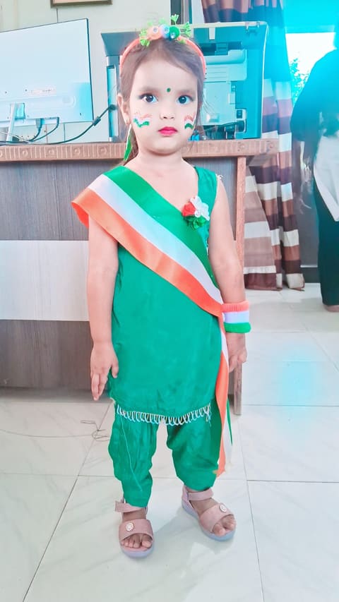 A young student in a tricolour outfit for the Independence Day celebration