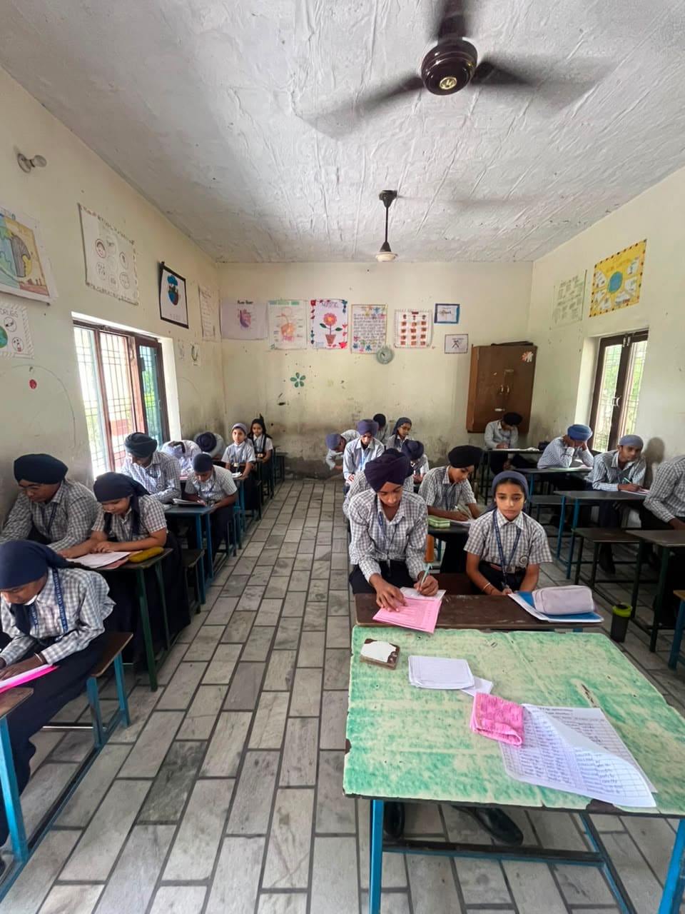 Senior students seated in rows working at their desks