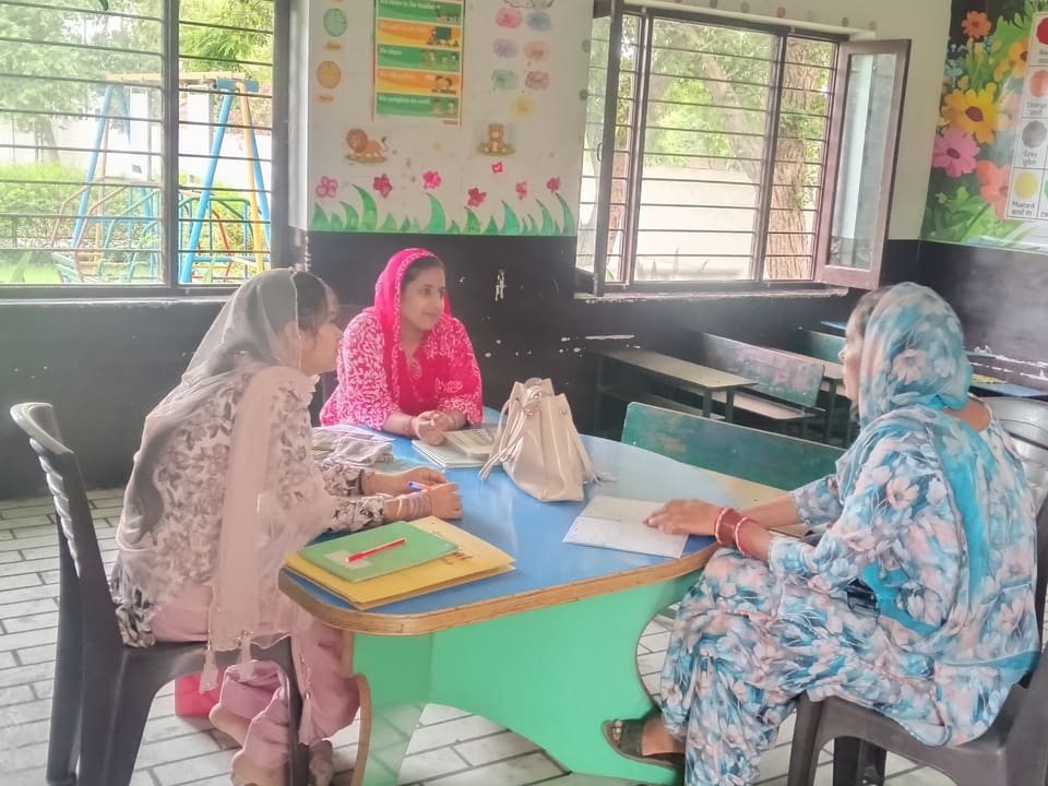 Staff at a desk in a brightly decorated primary classroom