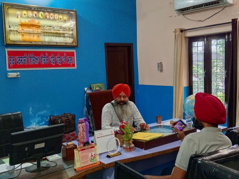 A student meeting staff in the school office
