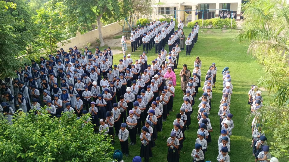 Students standing in disciplined rows during morning assembly