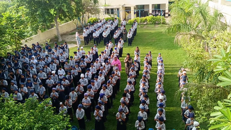 Students standing in disciplined rows for morning assembly