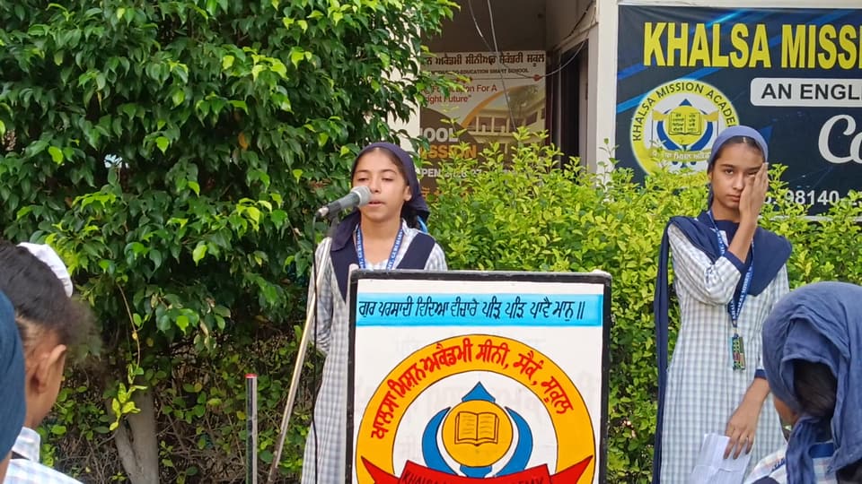 A student addressing the school from the assembly lectern