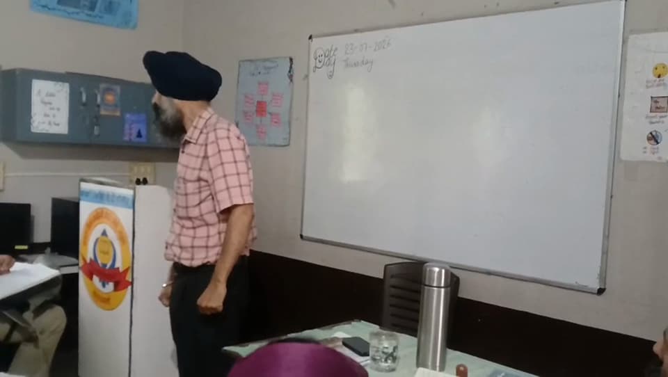 A teacher at the whiteboard in the smart classroom