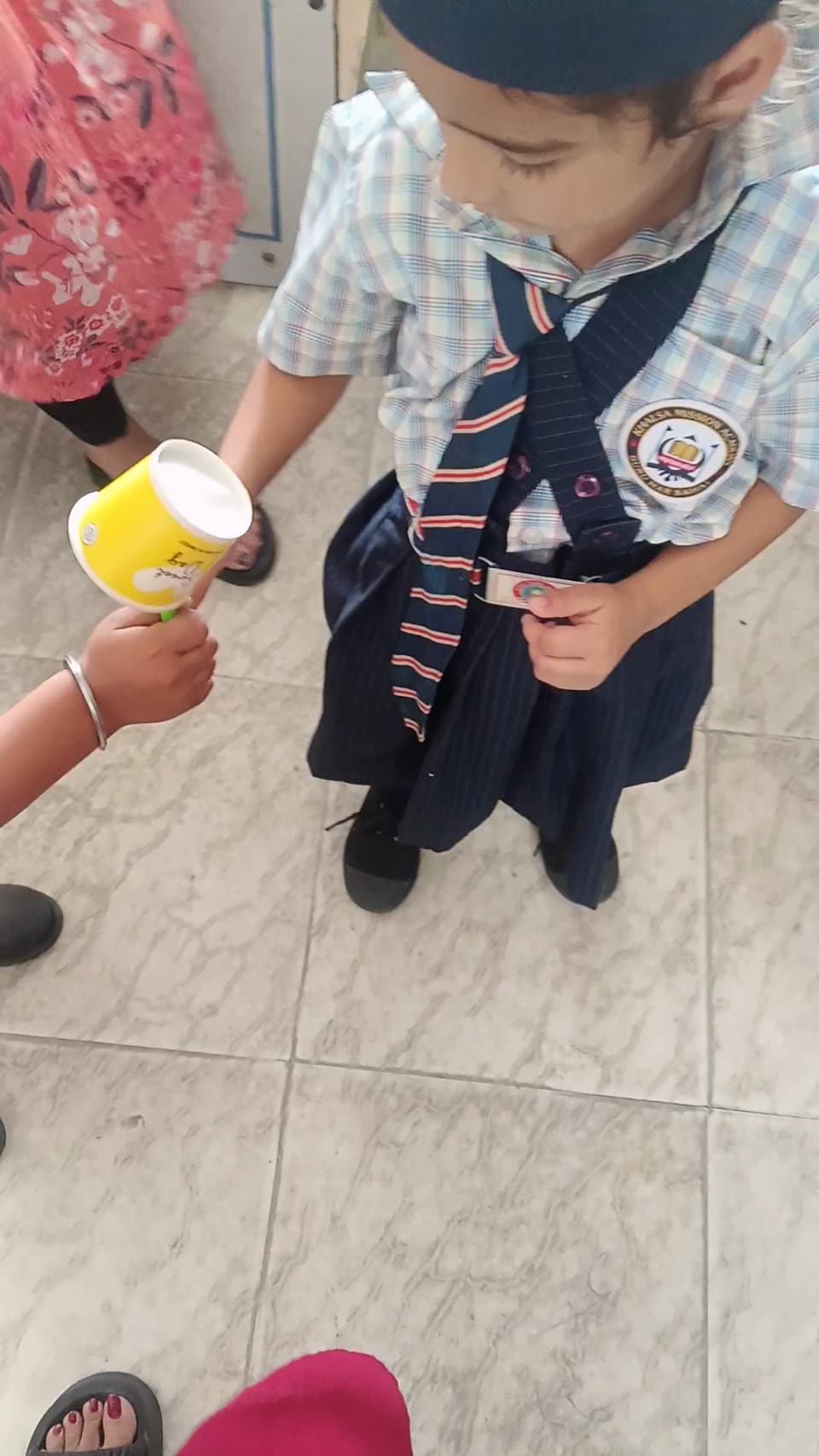 A young student helping hand out refreshments