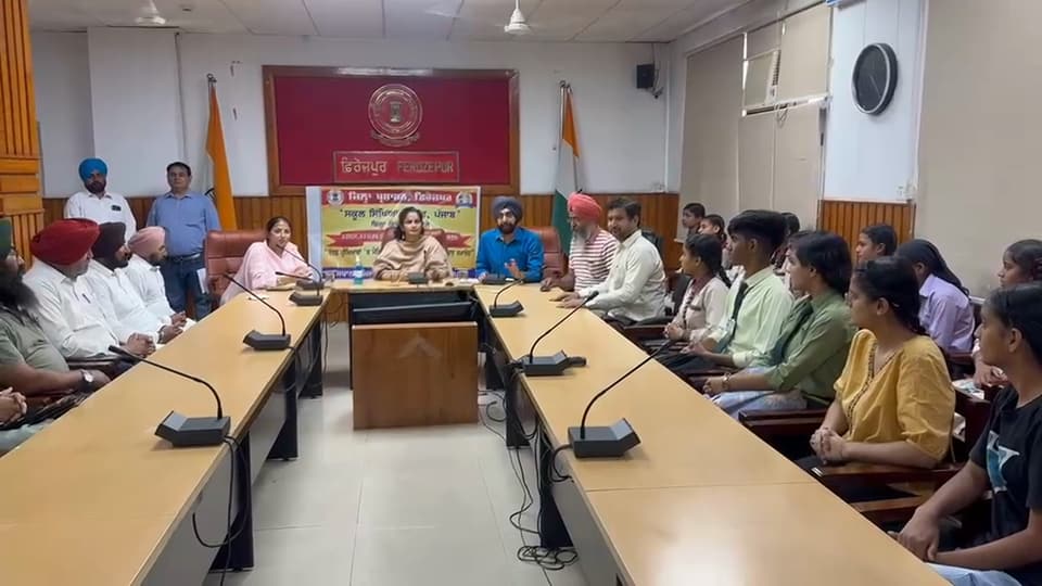A meeting in a conference hall with school representatives
