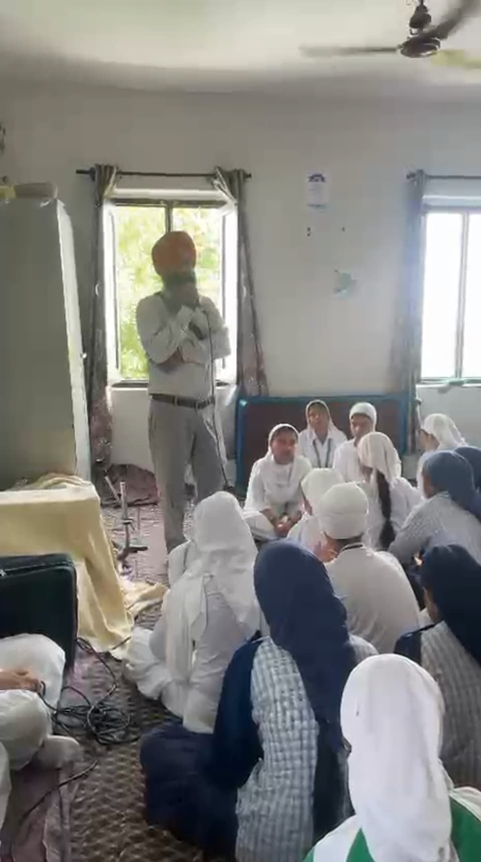 Students seated together for a kirtan gathering
